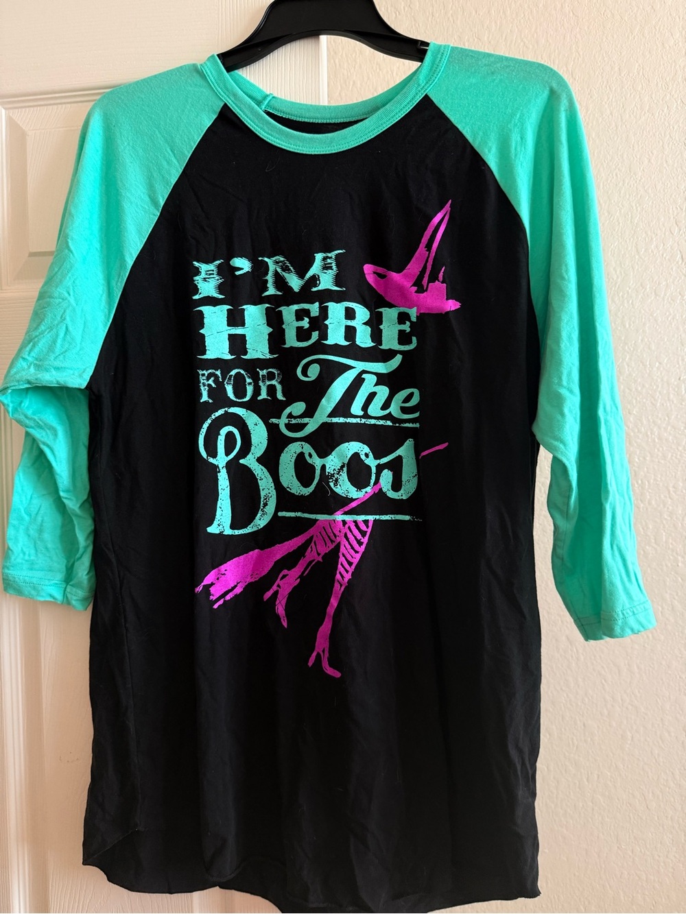 Women’s ' Black Raglan Tee with Teal Sleeves and Pink Graphic